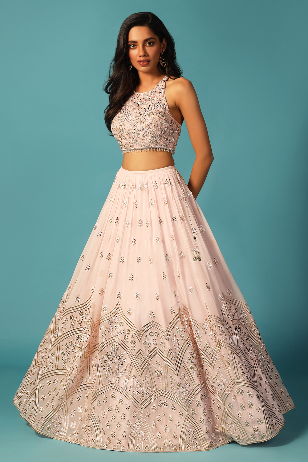 Photo of Baby pink lehenga with green and gold blouse and border