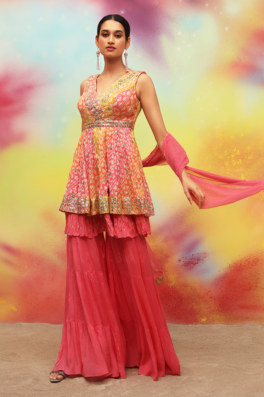 SWEET PINK TIERED WRINKLE SHARARA PANT SET AND A TIERED MULTI COLOURED  PRINTED PEPLUM STYLE KURTA TOP PAIRED WITH A MATCHING STOLE STYLE DUPATTA  AND PALE GOLD EMBELLISHMENTS  Seasons India