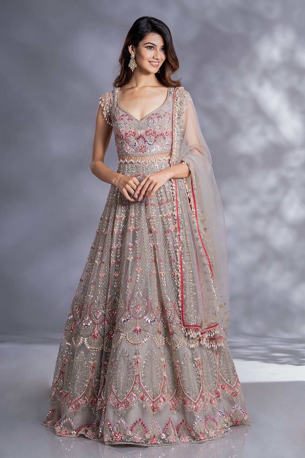 ASH GREY CLASSIC TULLE GOWN WITH A HAND EMBROIDERED BODICE AND SILVER  DETAILS PAIRED WITH A MATCHING FRILL DUPATTA. - Seasons India